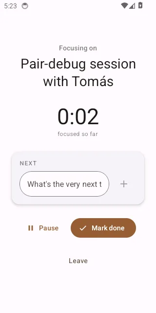 The mobile focus screen mid-session: task title, count-up timer, the Next action with its checkbox, and the Pause / Mark done buttons.
